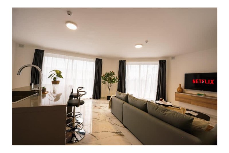 Bright open-plan living room in a HostMT apartment